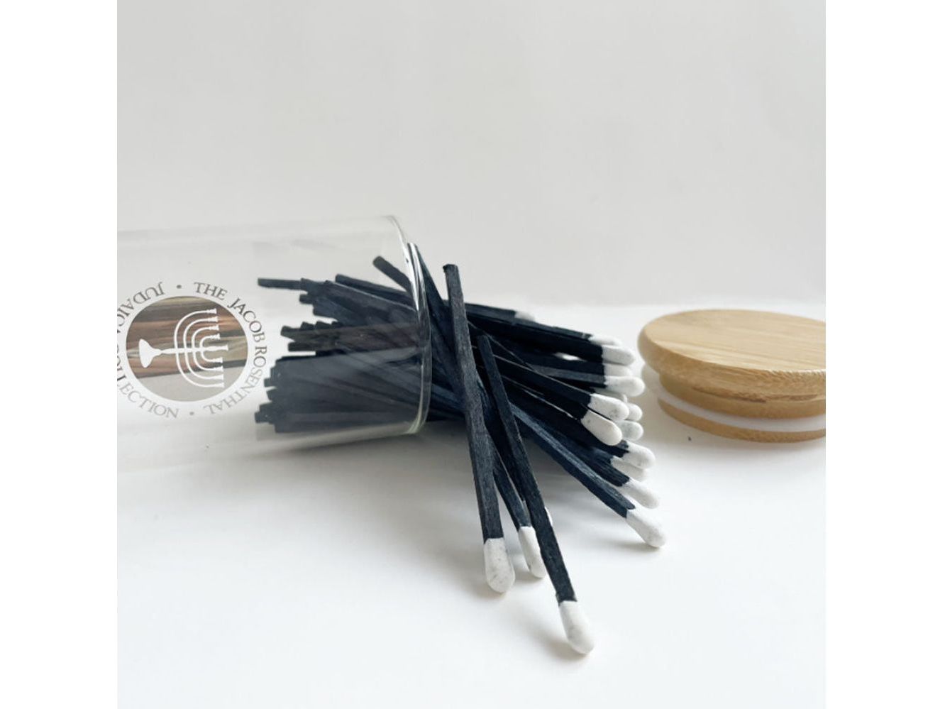 Blue Matches in Glass Container