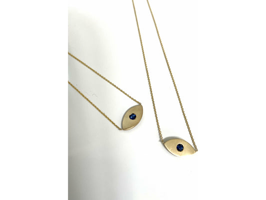 14k yellow gold evil eye necklace with .10ct blue sapphire