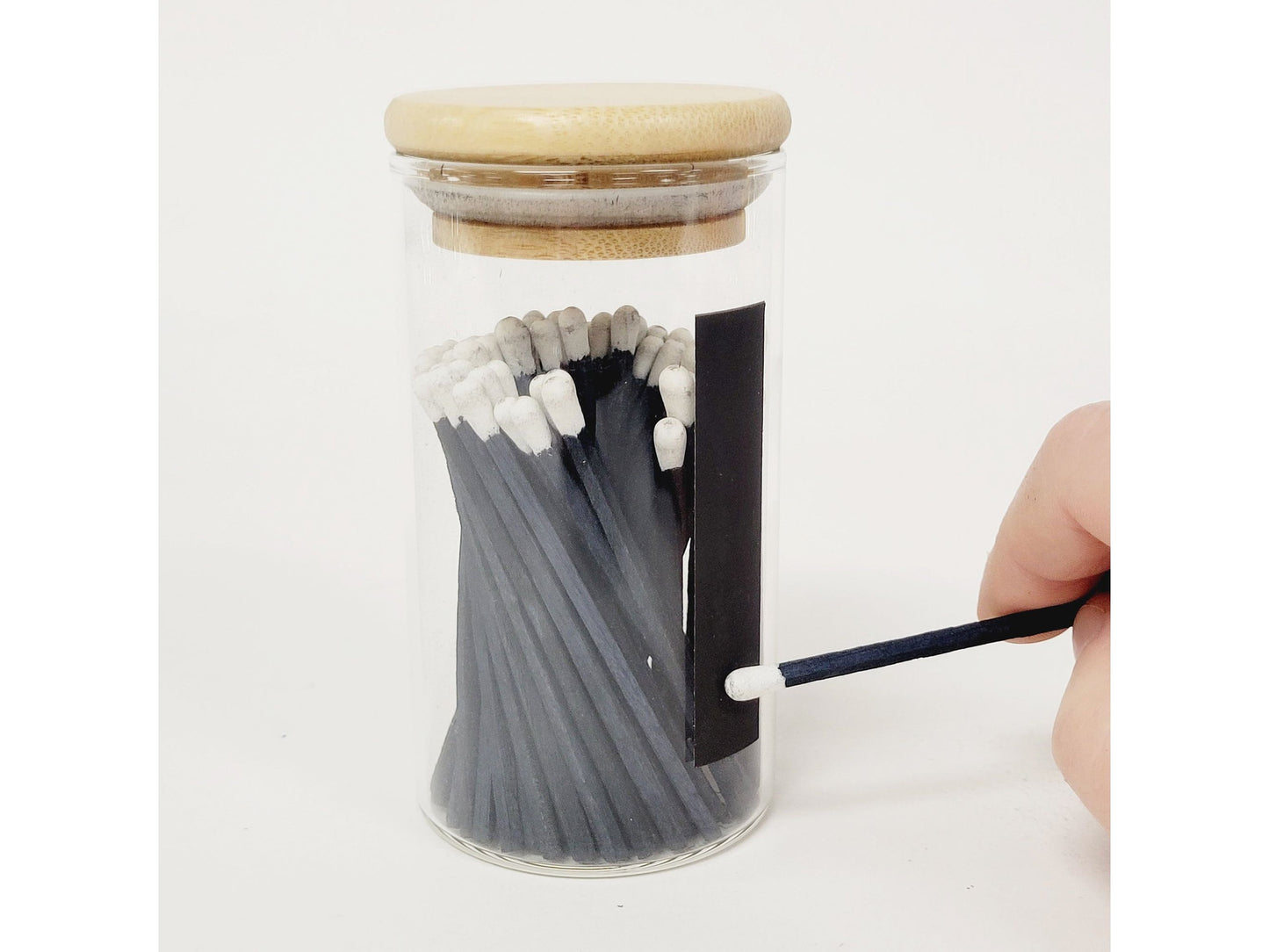 Blue Matches in Glass Container