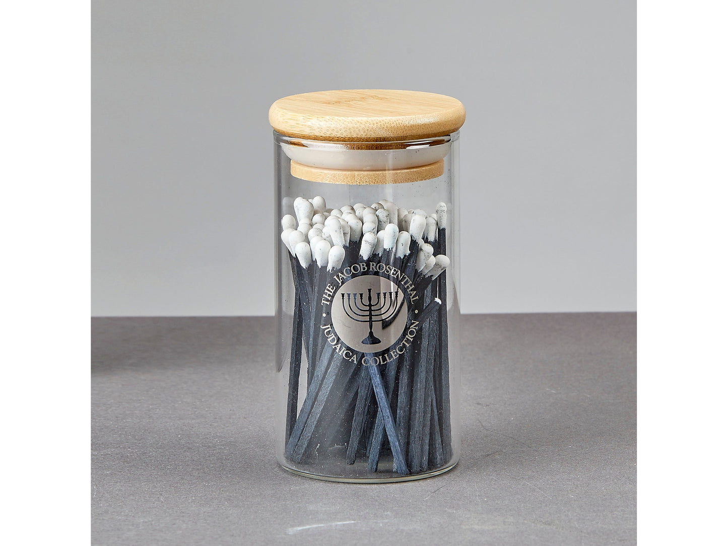 Blue Matches in Glass Container